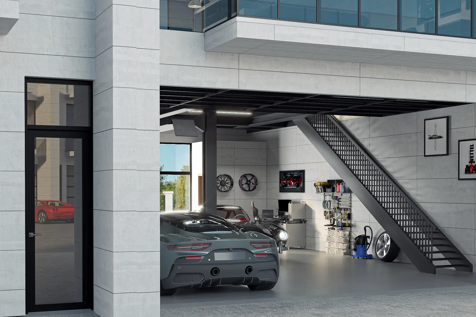 An open bay seen from the motor court: cars parked on the showroom floor, an architectural steel staircase, and the second level set above with a glass balcony.