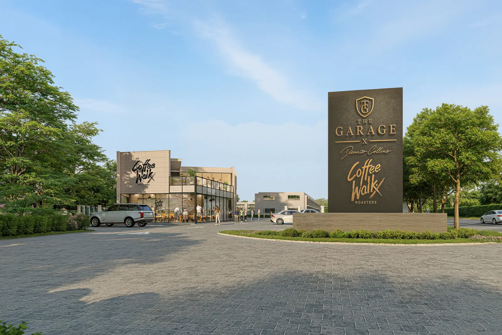 The monument entrance at The Garage, carrying the crest and the Coffee Walk mark, with the coffee house and gated campus behind.
